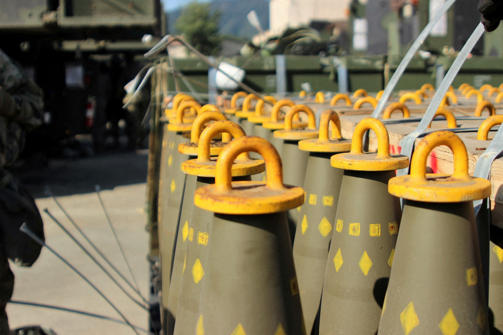 FILE PHOTO: Dozens of 155mm Base Burn Dual Purpose Improved Conventional Munitions (DPICM) rounds wait to be loaded at a U.S. Army motor pool at Camp Hovey, South Korea September 20, 2016. U.S. Army/2nd Lt. Gabriel Jenko/Handout via REUTERS THIS IMAGE HAS BEEN SUPPLIED BY A THIRD PARTY./File Photo